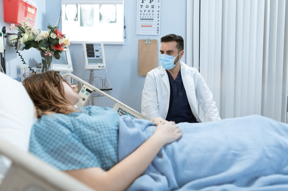 Doctor at a patient's bedside